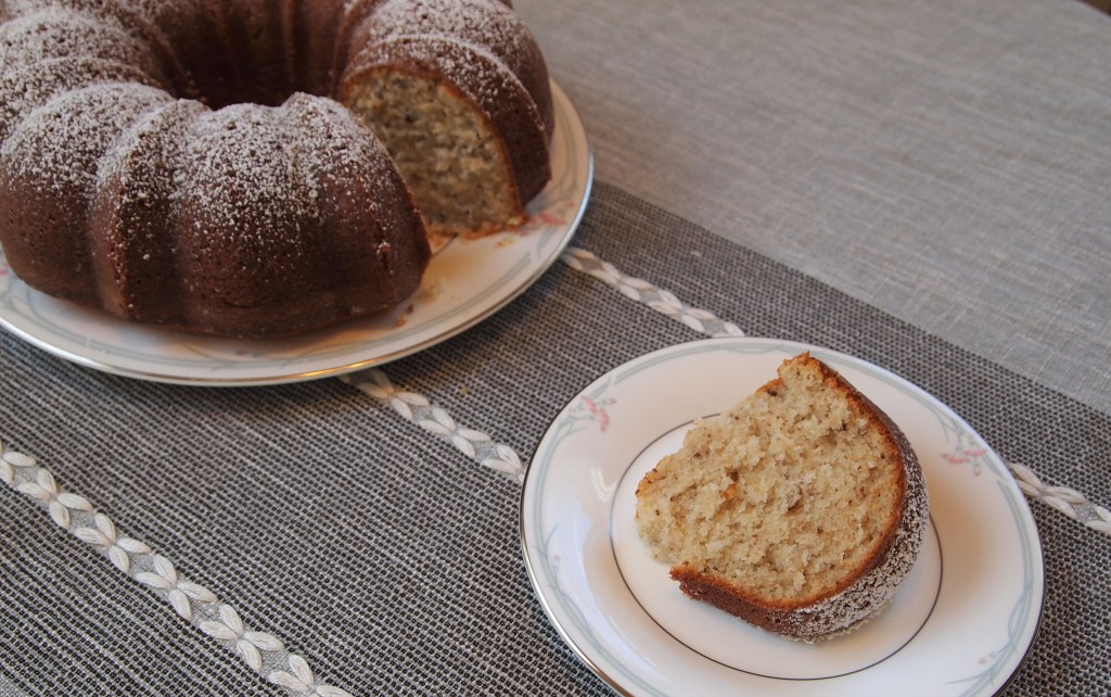 a black walnut bundt cake, with one slice cut out