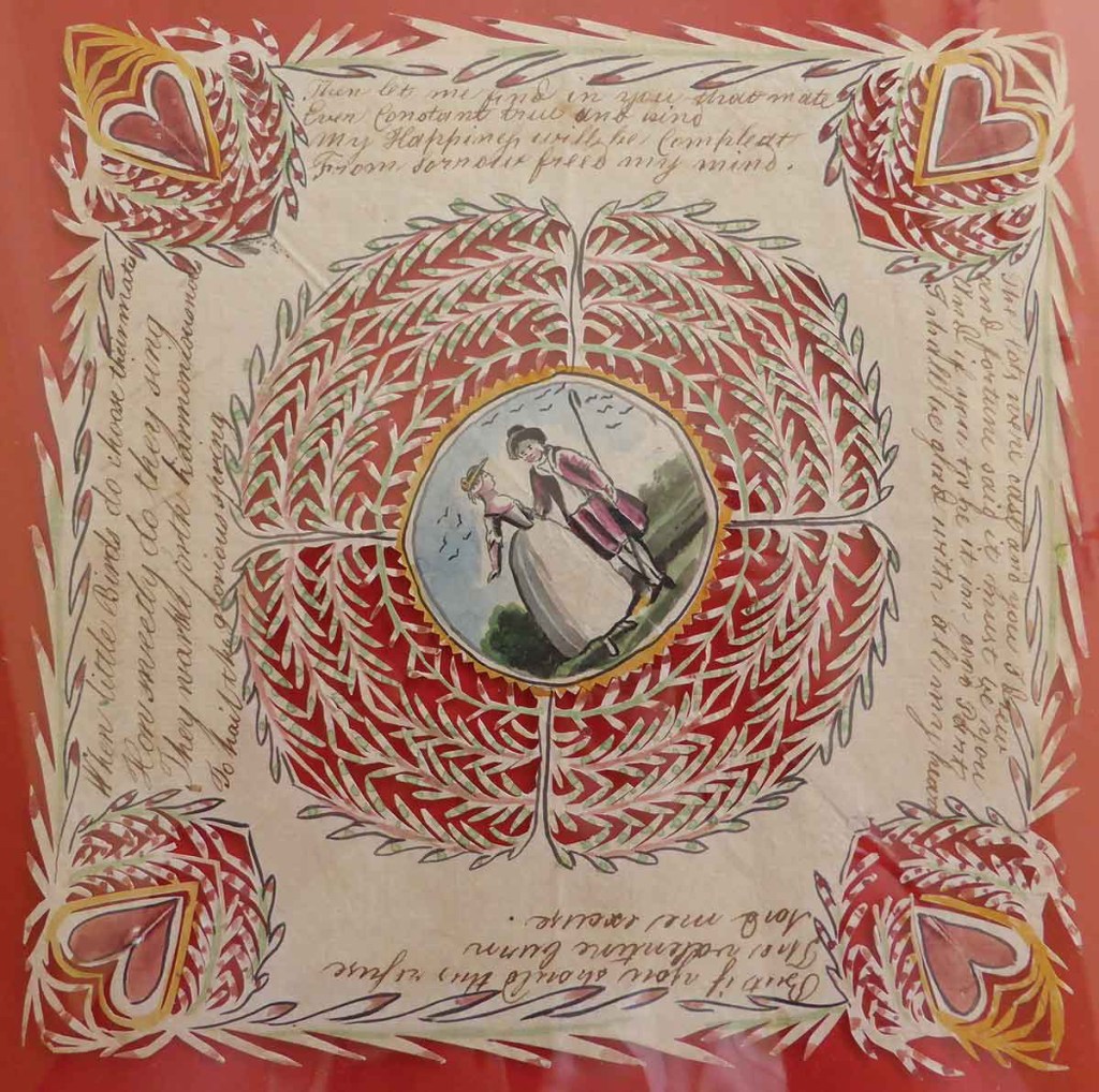 hand-painted valentine card featuring a man and a woman in the center and four hearts in the corners